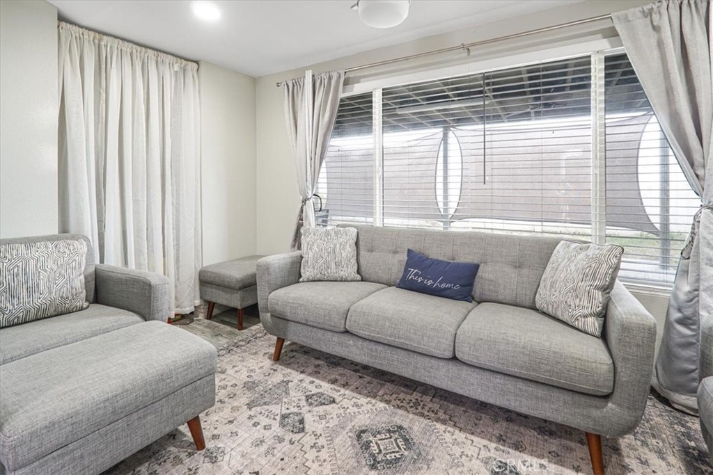 33962 Clark Lane Yucaipa, CA 92399 - Photo 17 of 48 a living room with furniture and a large window