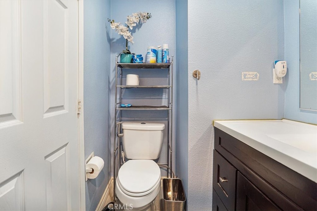 33962 Clark Lane Yucaipa, CA 92399 - Photo 20 of 48 a white toilet sitting next to a bathroom sink