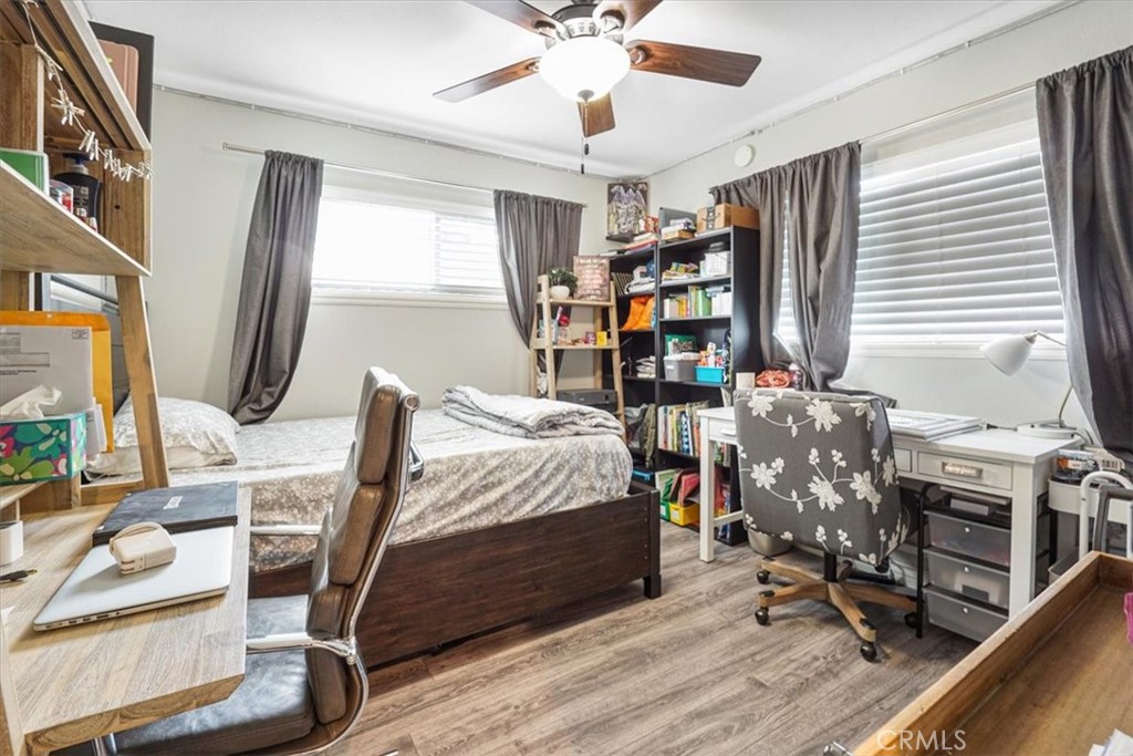 33962 Clark Lane Yucaipa, CA 92399 - Photo 24 of 48 a bedroom with furniture a bed and a chandelier