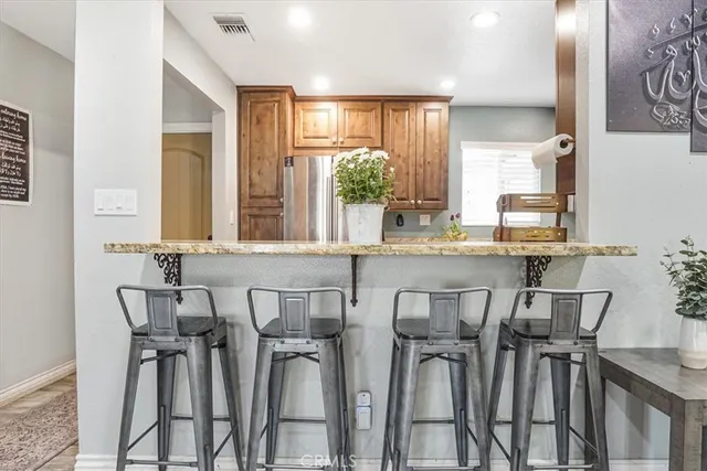 a view of a dining room with furniture and window