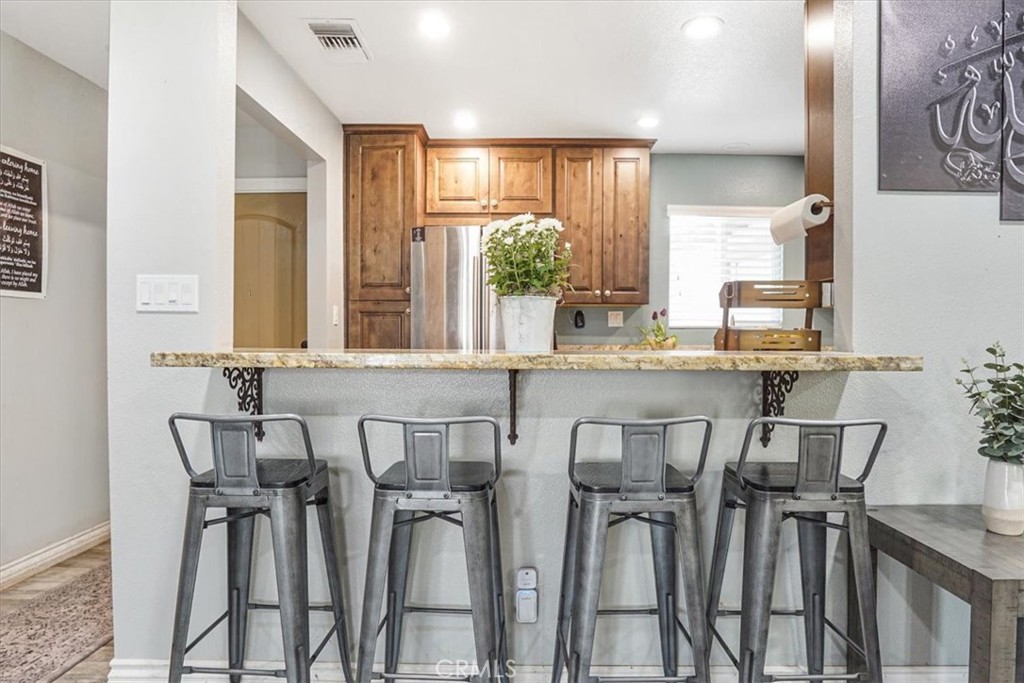 33962 Clark Lane Yucaipa, CA 92399 - Photo 5 of 48 a view of a dining room with furniture and window