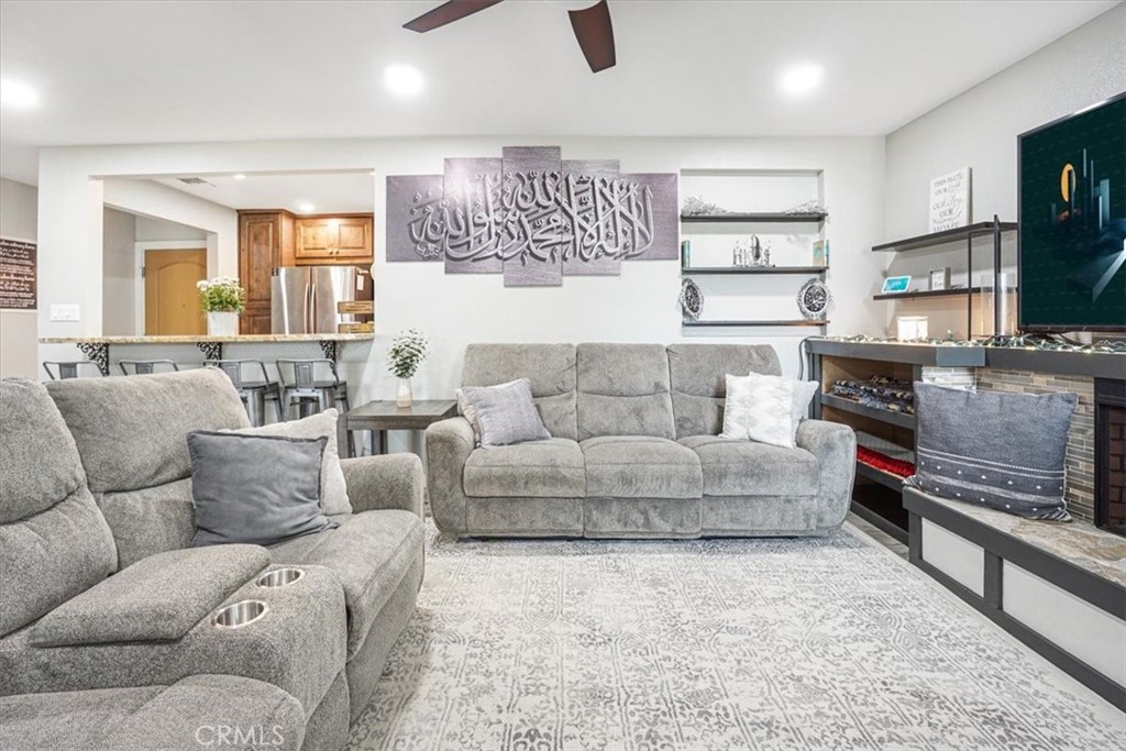 33962 Clark Lane Yucaipa, CA 92399 - Photo 9 of 48 a living room with furniture and a flat screen tv