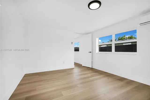 a view of a livingroom with wooden floor