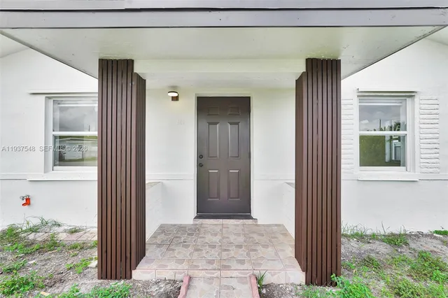 a view of a door and a window