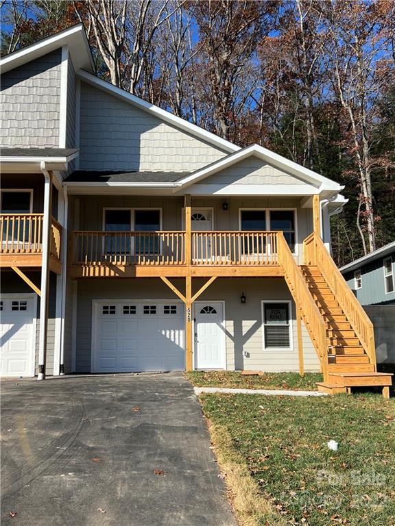 520 Sycamore Br Road Asheville, NC 28803 - Photo 1 of 1 a front view of a house with garage