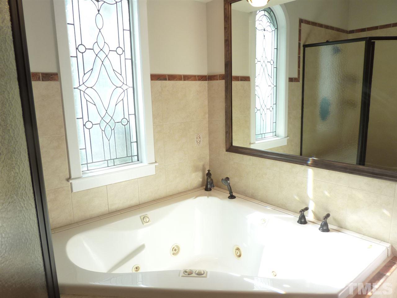 1519 Pleasant Green Road Durham, NC 27705 - Photo 18 of 30 Jacuzzi Tub for those days you want to soak. A tile has been loosened to give access to heater and plumbing for future inspections. Do not attempt to remove, it will be removed and replaced for inspection.