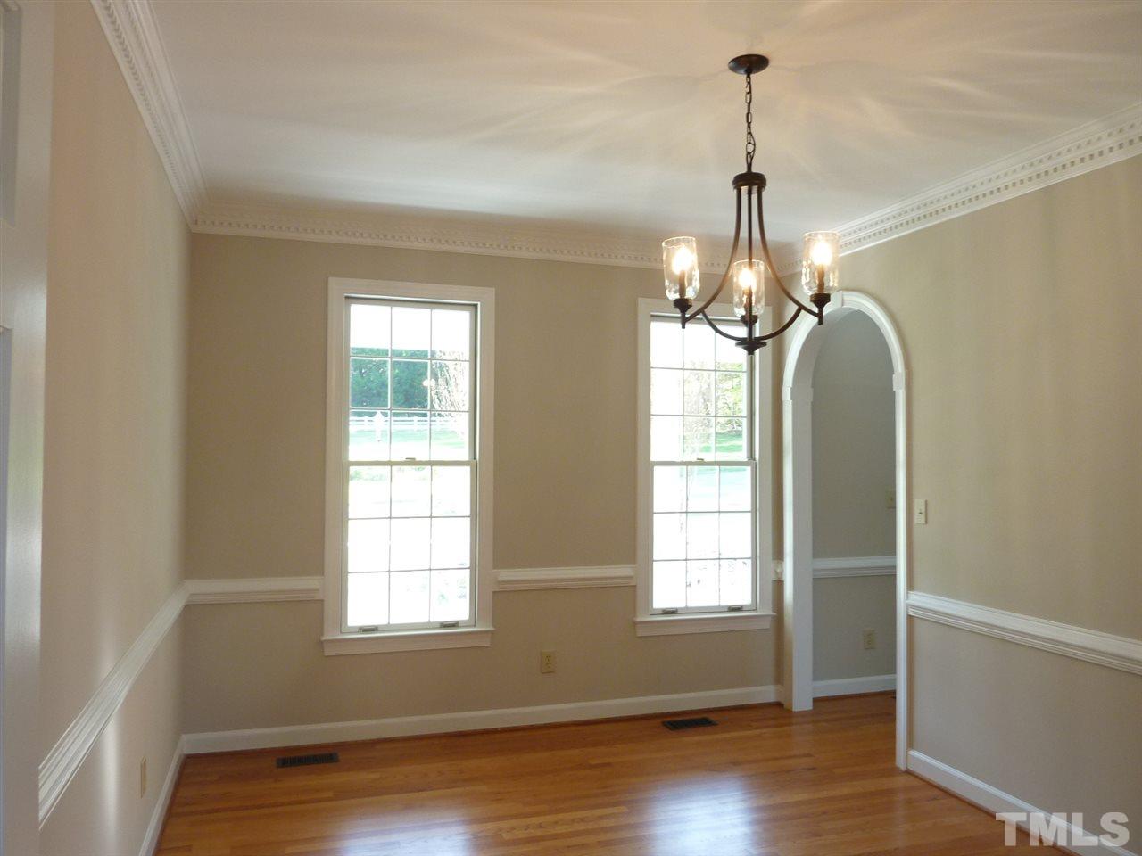 1519 Pleasant Green Road Durham, NC 27705 - Photo 9 of 30 Formal Dining room with chair rail and beautiful moldings.
