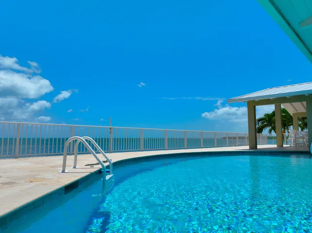 a view of swimming pool with a yard