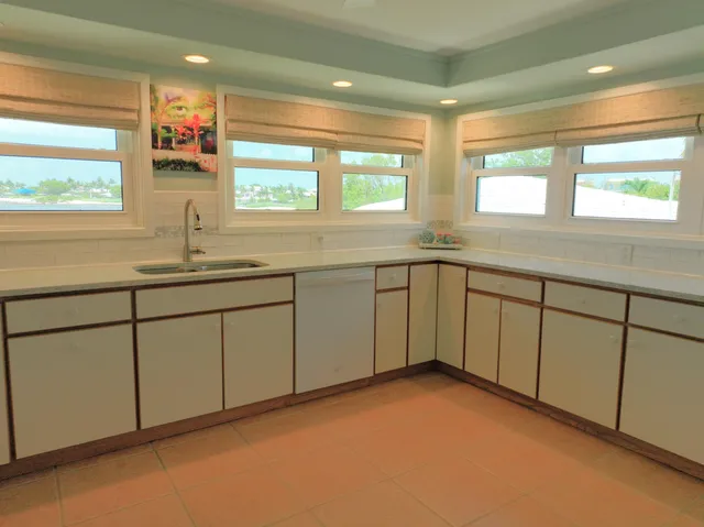 a kitchen with sink and window
