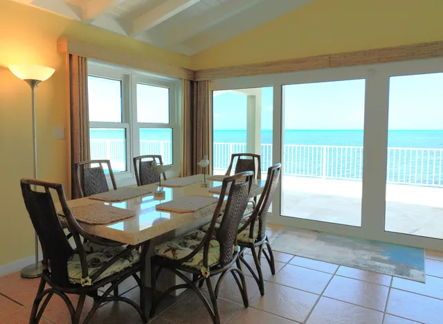 a view of a dining room with furniture and a window