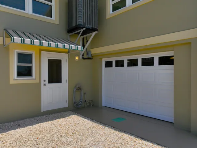 a front view of a house with a garage