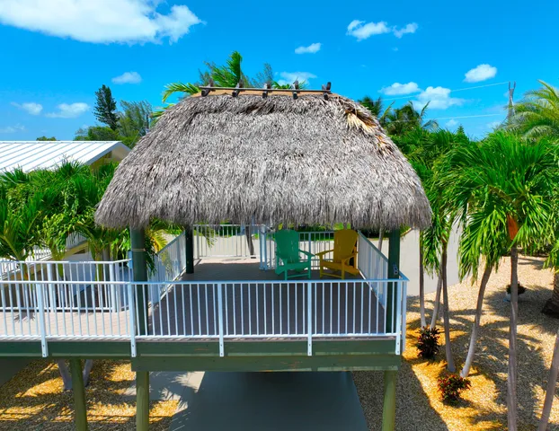 a view of a patio with a table & chairs