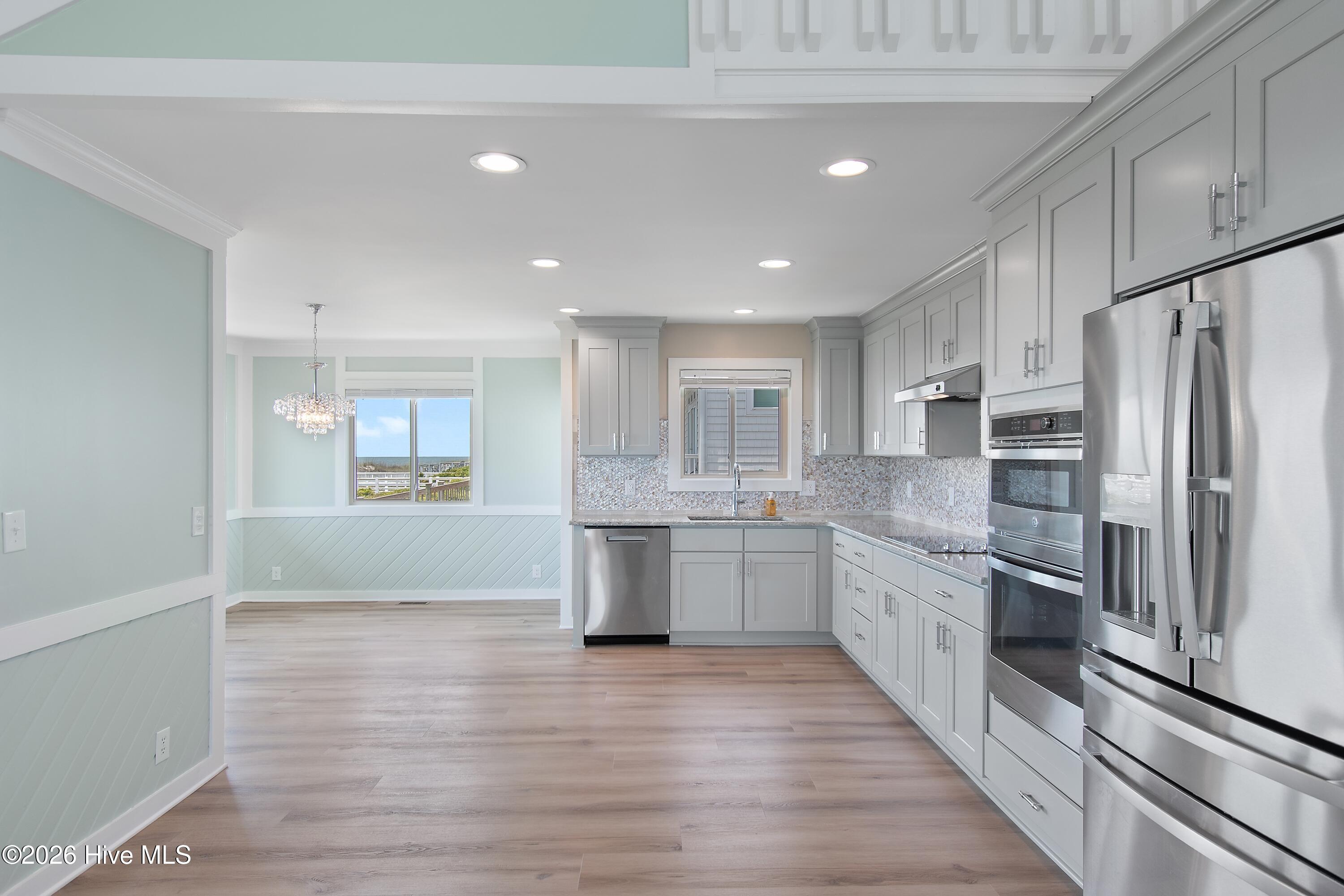 645 Caswell Beach Road Oak Island, NC 28465 - Photo 12 of 77 Chef's Kitchen and Dining Room