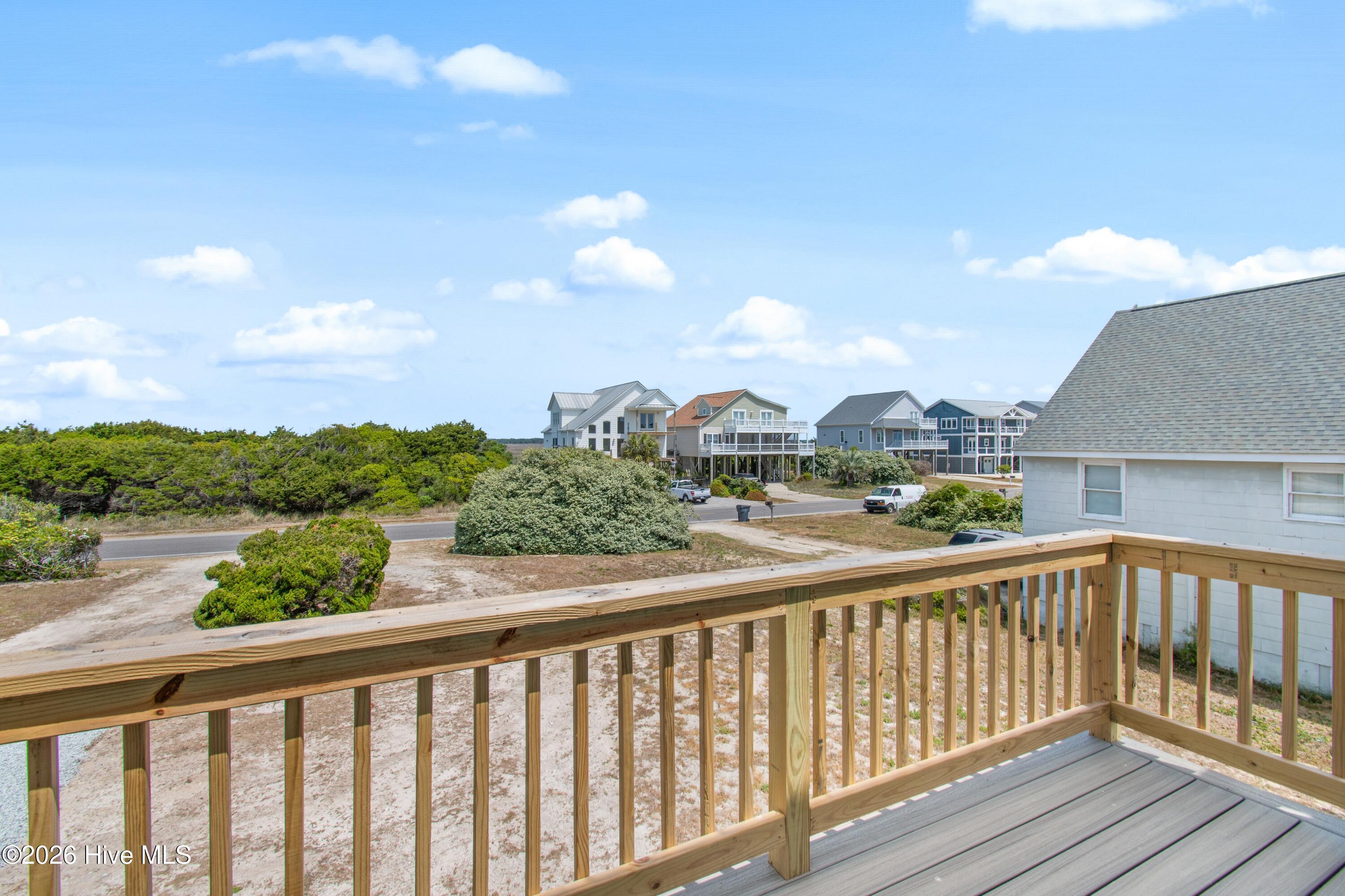 645 Caswell Beach Road Oak Island, NC 28465 - Photo 24 of 77 Bedroom One Left Side Deck