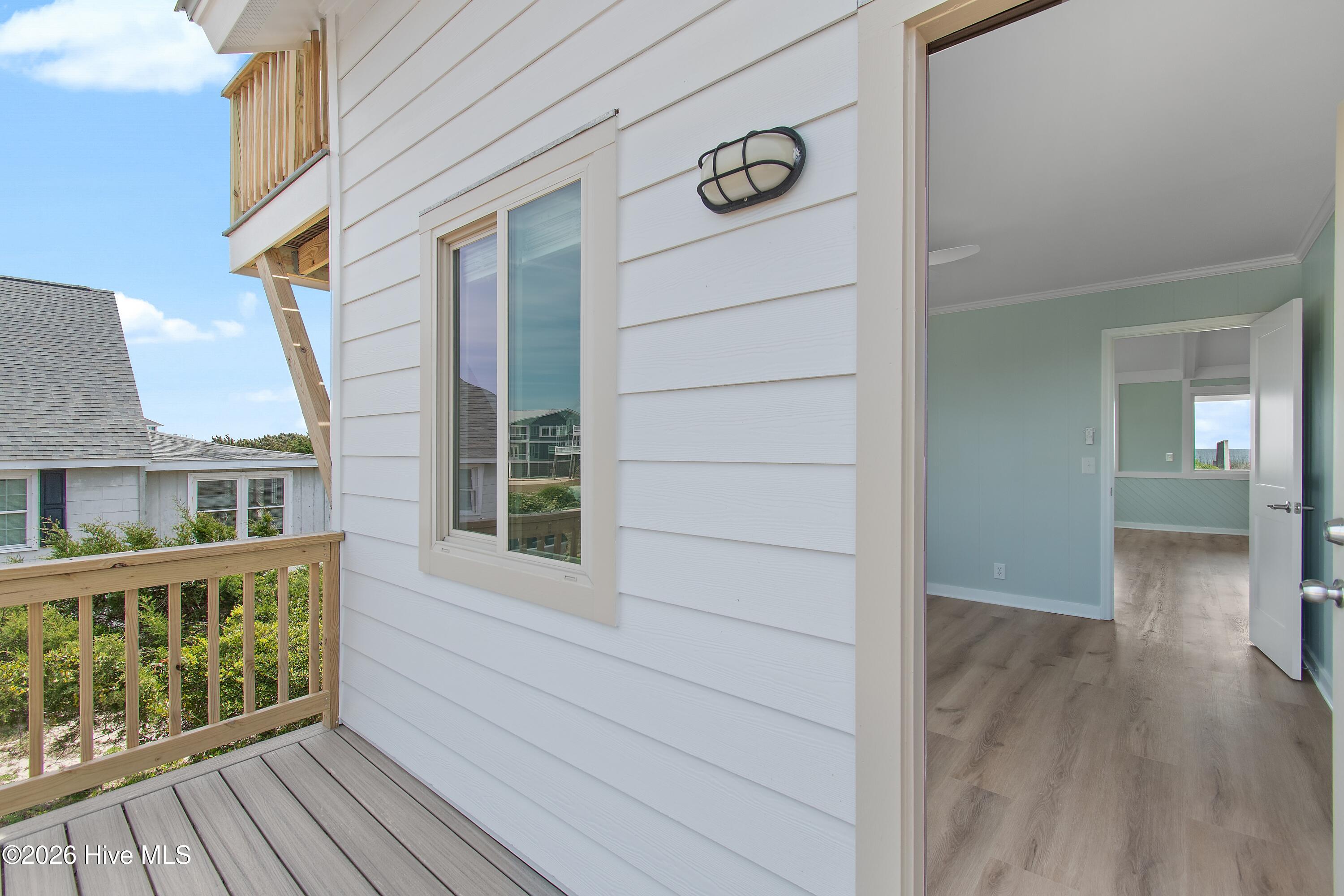645 Caswell Beach Road Oak Island, NC 28465 - Photo 25 of 77 Bedroom One Left Side Deck
