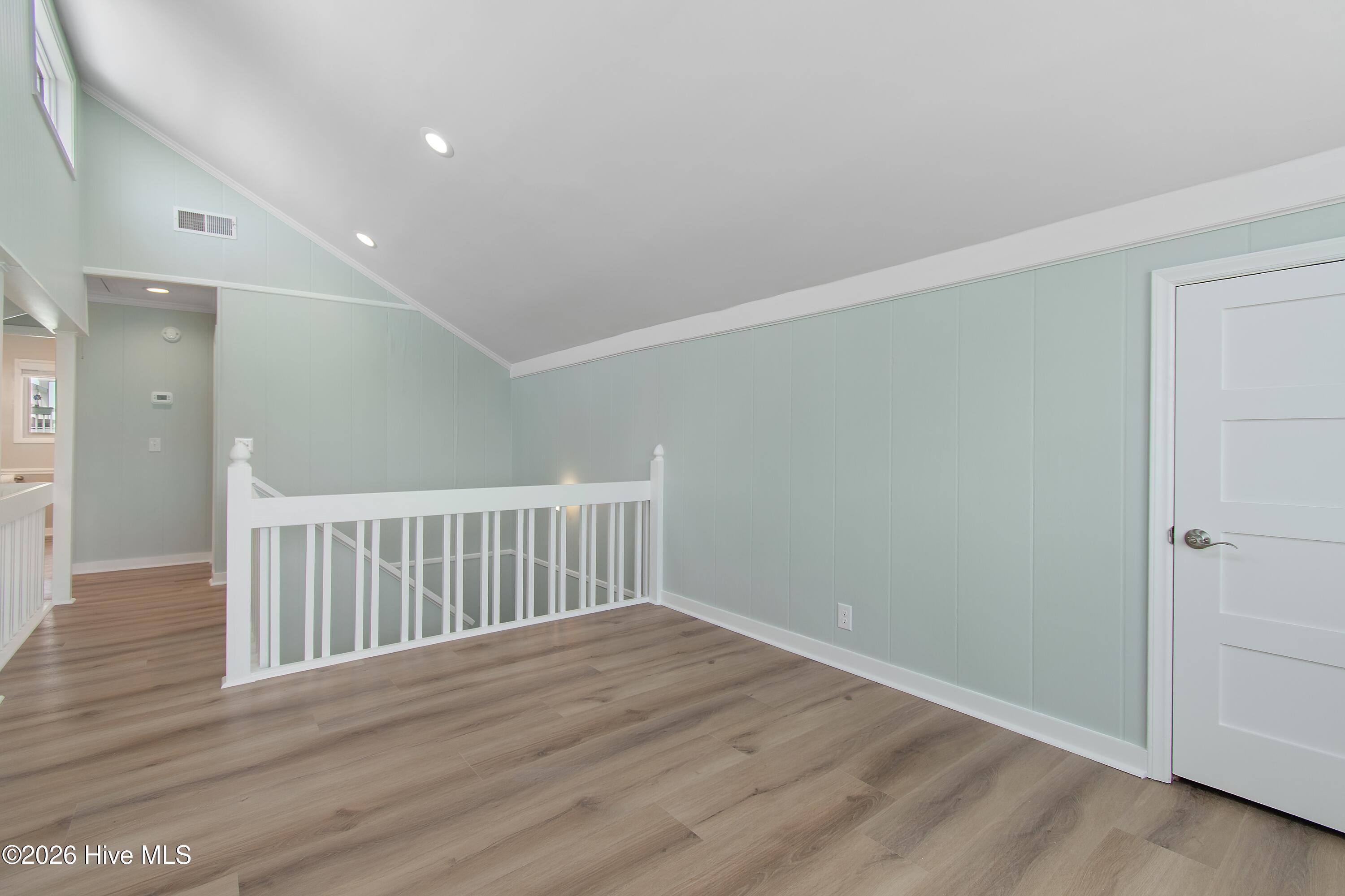 645 Caswell Beach Road Oak Island, NC 28465 - Photo 40 of 77 Loft towards Stairs