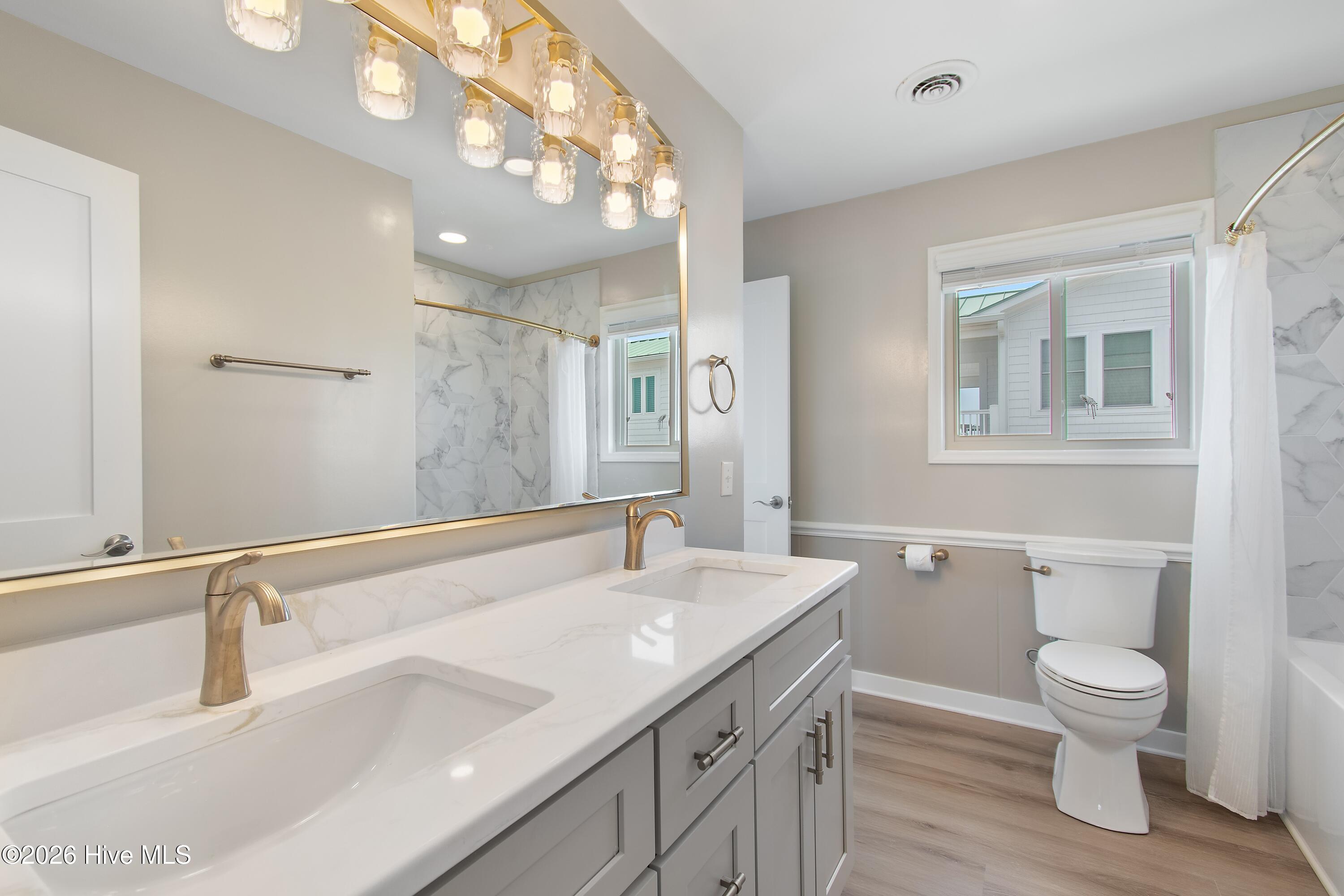 645 Caswell Beach Road Oak Island, NC 28465 - Photo 43 of 77 Primary Bath Dual Vanity