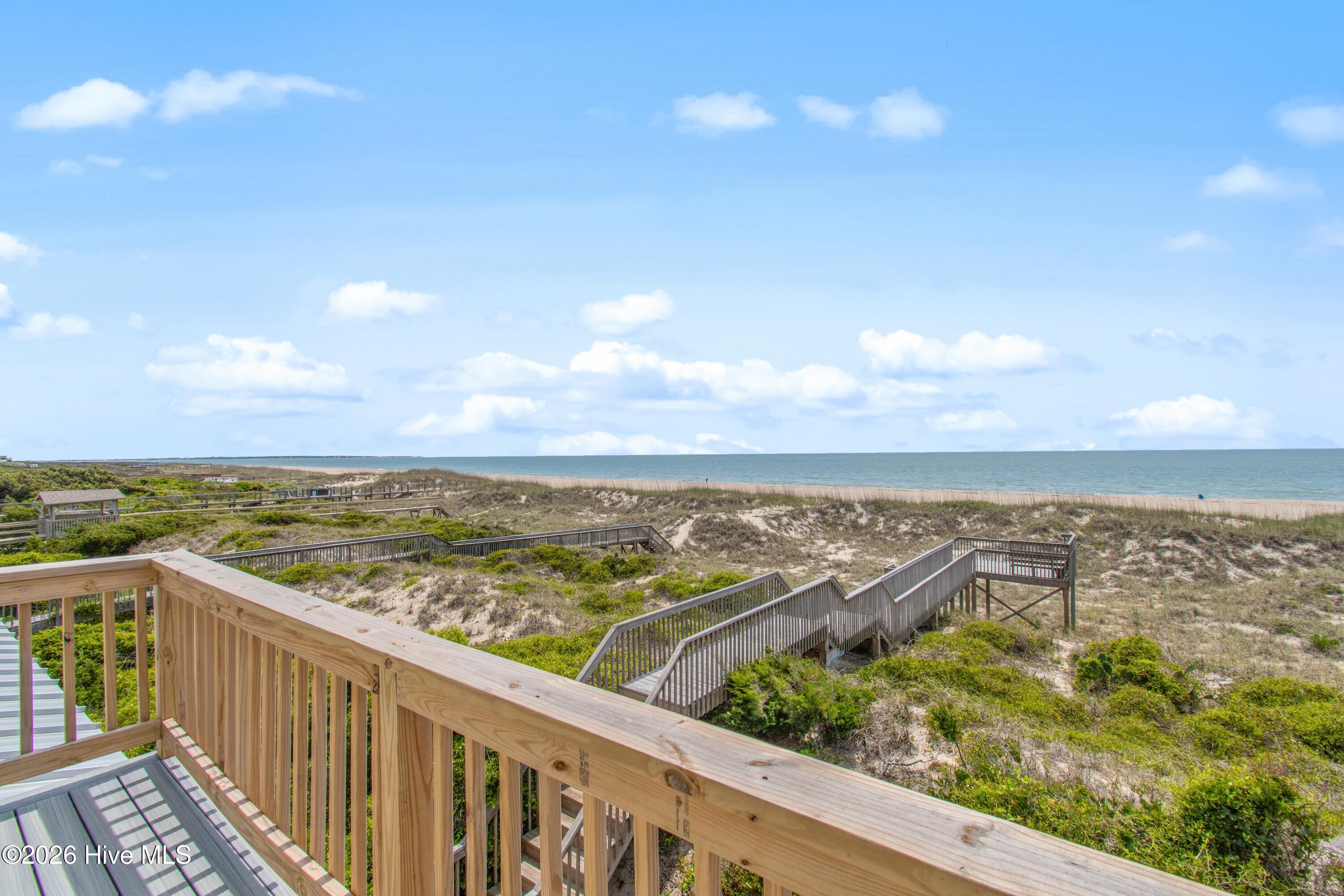 645 Caswell Beach Road Oak Island, NC 28465 - Photo 48 of 77 Primary Deck Ocean View Towards Bald Head Island