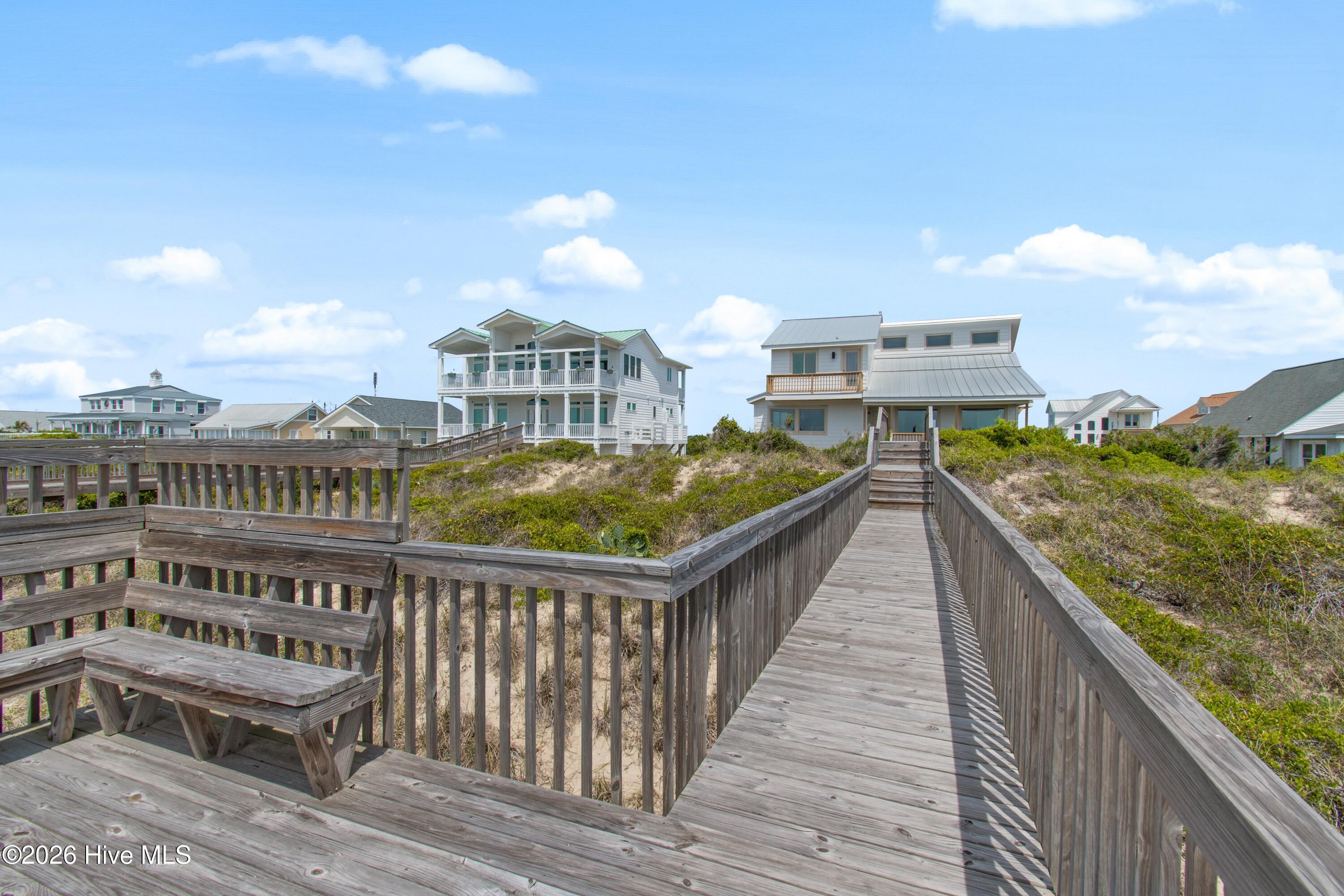 645 Caswell Beach Road Oak Island, NC 28465 - Photo 53 of 77 Sitting Area at end of Walkway