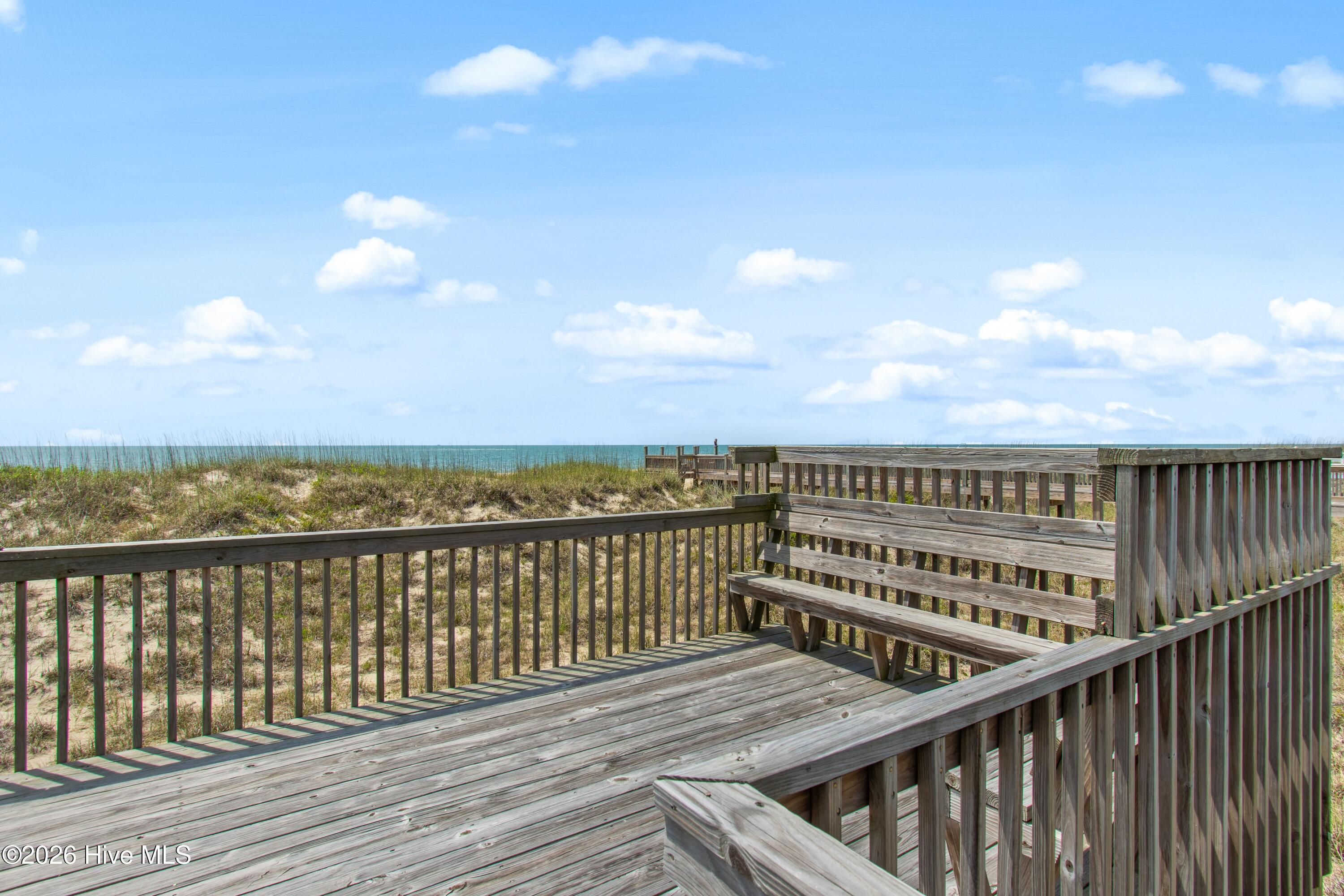 645 Caswell Beach Road Oak Island, NC 28465 - Photo 54 of 77 Sitting Area at end of Walkway