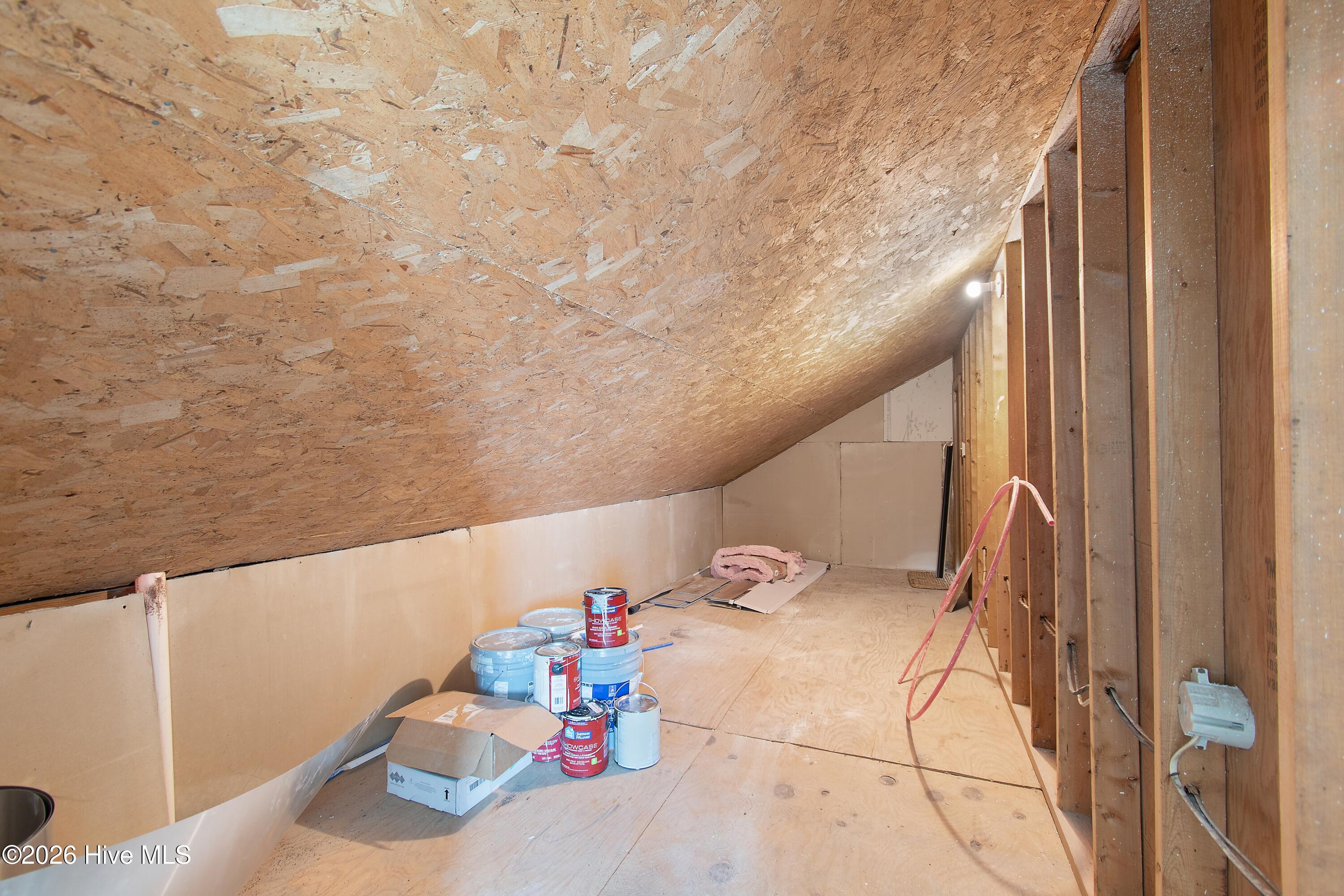 645 Caswell Beach Road Oak Island, NC 28465 - Photo 63 of 77 Eaves Storage Behind Loft Second Floor
