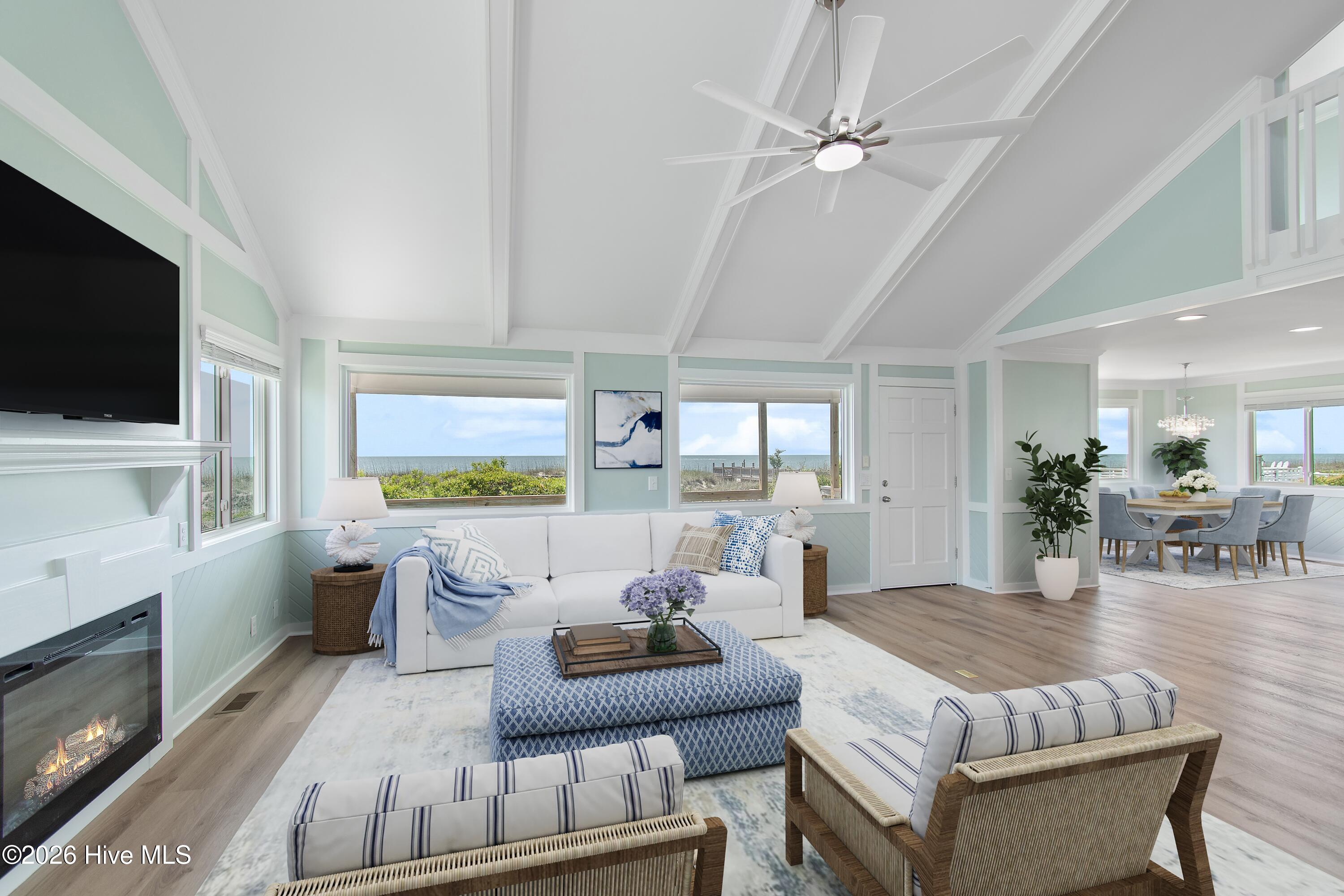 645 Caswell Beach Road Oak Island, NC 28465 - Photo 7 of 77 This photo has been virtually staged to show how the room could look furnished.