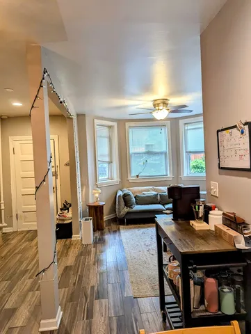 a view of a livingroom with furniture and wooden floor