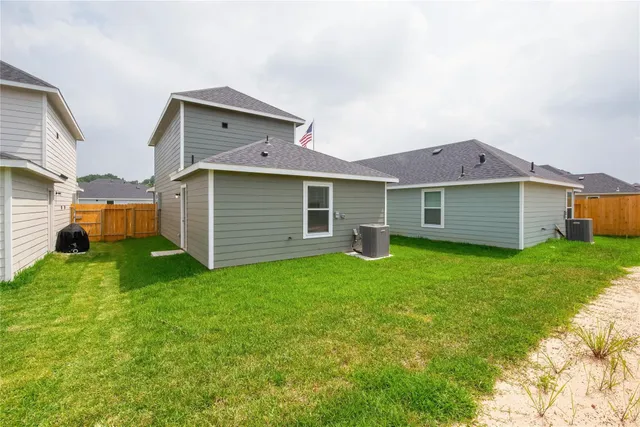 a view of a house with a back yard