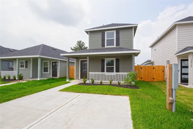 a front view of a house with a yard and front view of a house