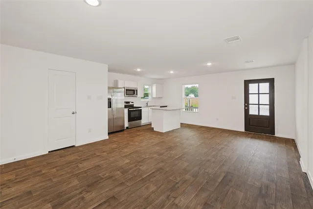 a view of a kitchen with a sink cabinets and a window
