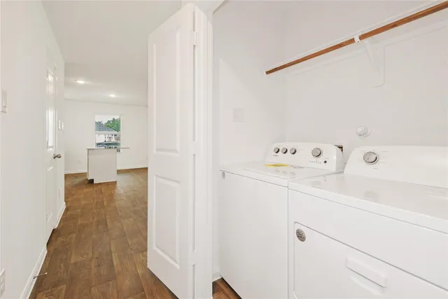 a view of hallway with wooden floor