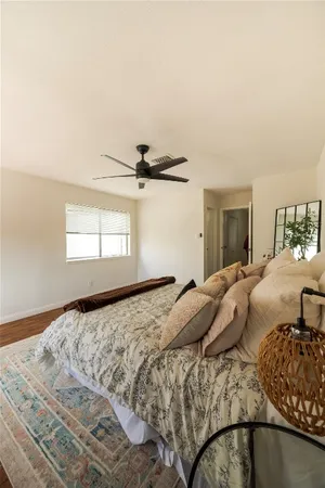 a living room with kitchen island furniture and a wooden floor