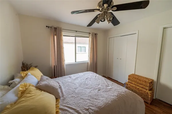 a bedroom with a bed and chandelier