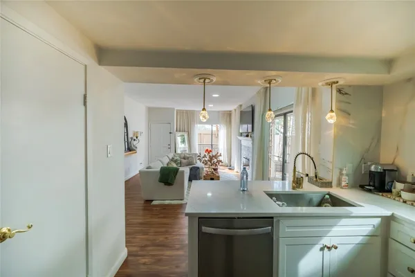 a view of a kitchen from the hallway