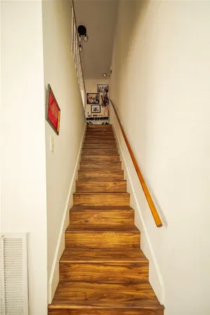 a bathroom with a sink a mirror and a toilet
