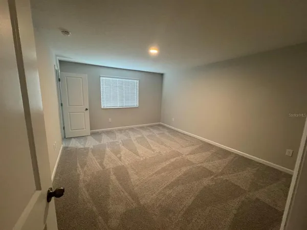 en empty room with windows