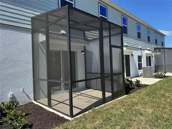 a balcony with a glass door