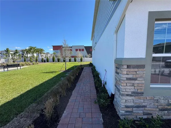 a view of a pathway with a yard