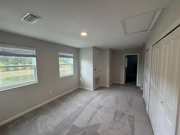 a view of an empty room with a window