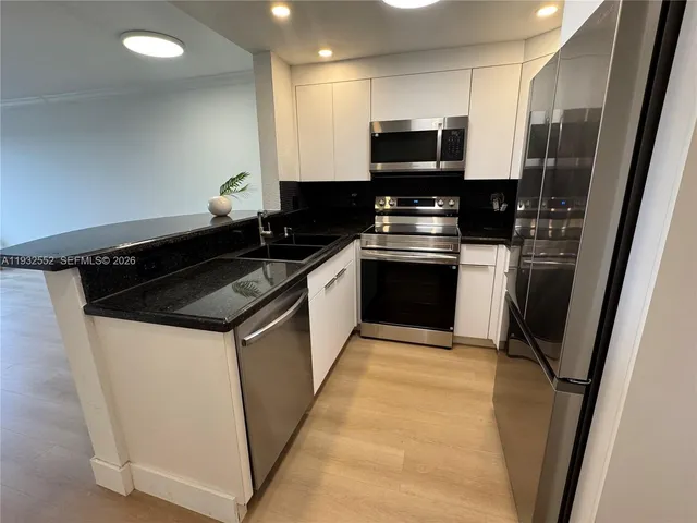 a kitchen with a stove and a microwave