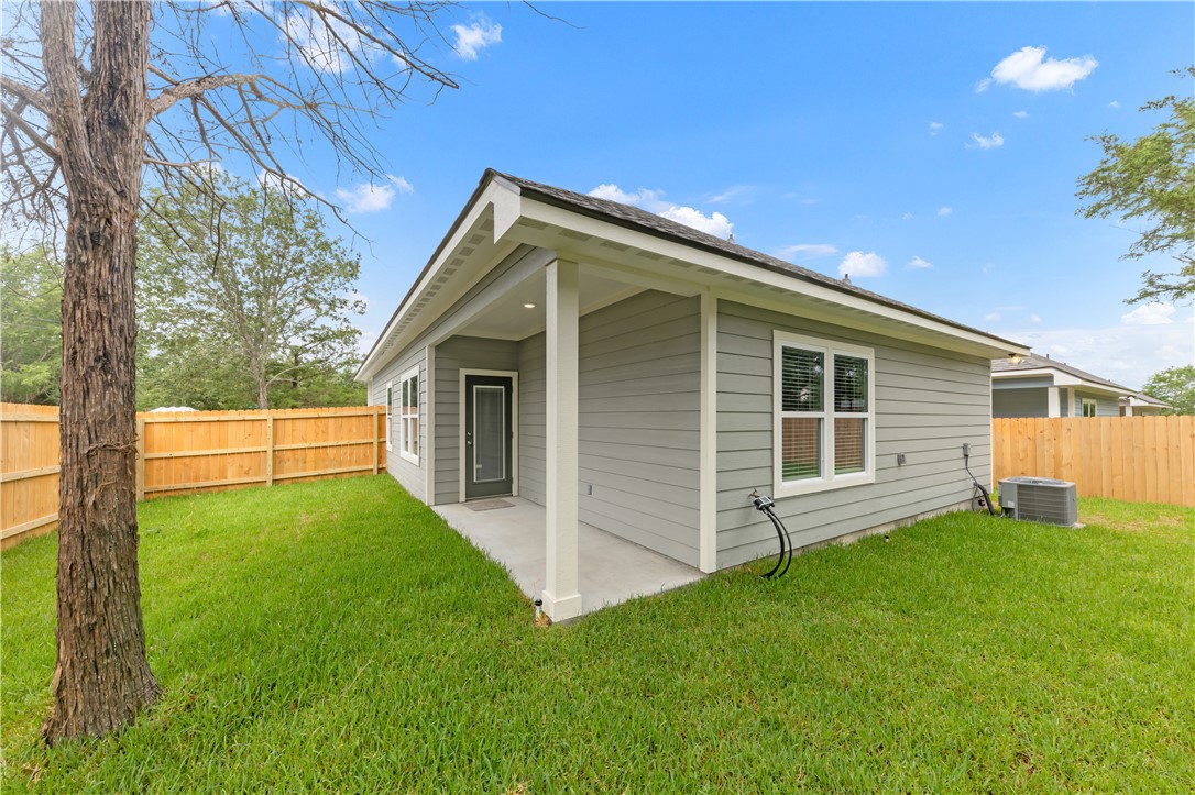 1805 Pin Oak Street Bryan, TX 77803 - Photo 20 of 20 Back of property featuring a fenced backyard and a patio