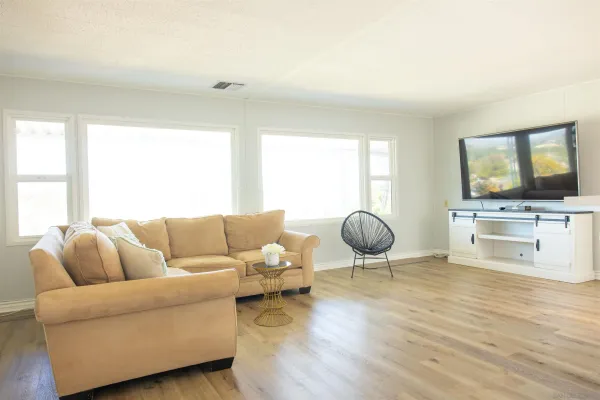 a living room with furniture and a large window