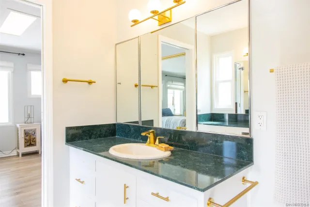 a bedroom with a bed and a book shelf