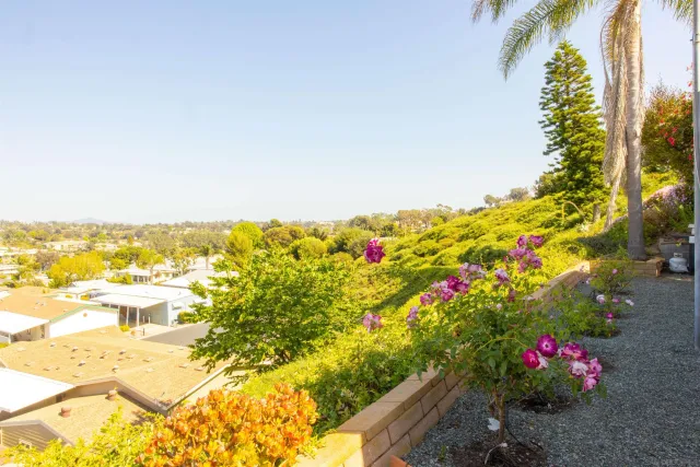 a view of house with an entryway and stairs