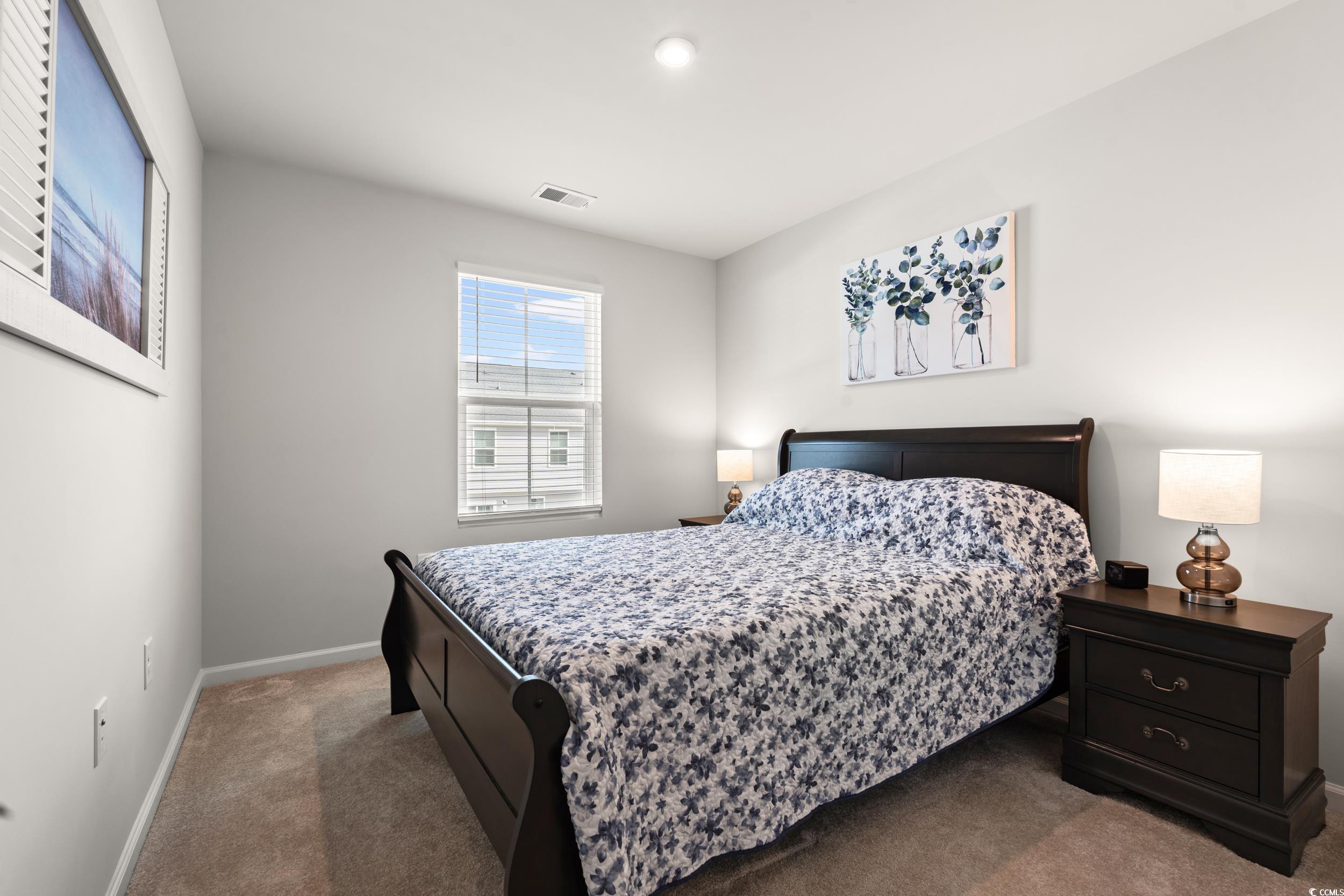 301 Granada Street, Unit D Myrtle Beach, SC 29579 - Photo 15 of 33 Carpeted bedroom featuring baseboards