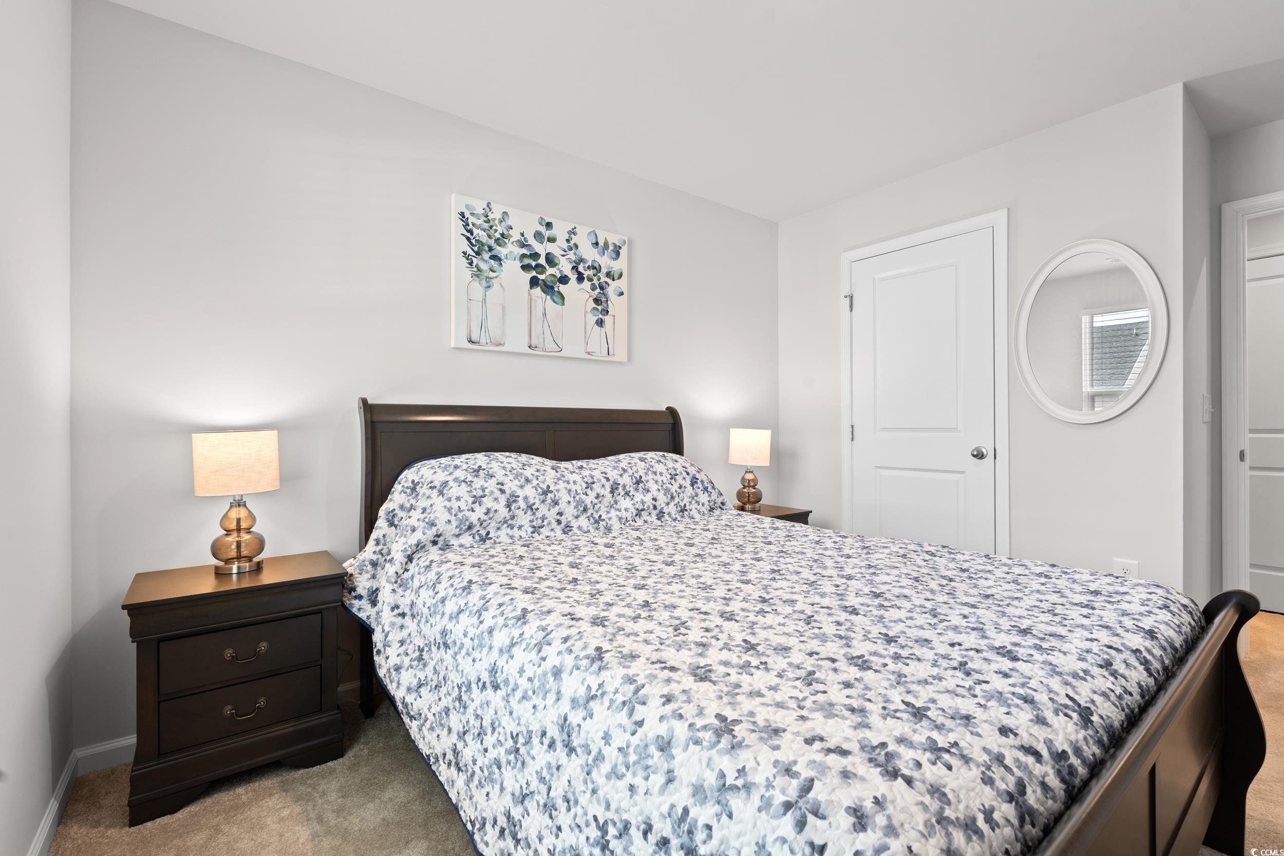 301 Granada Street, Unit D Myrtle Beach, SC 29579 - Photo 16 of 33 Carpeted bedroom with baseboards