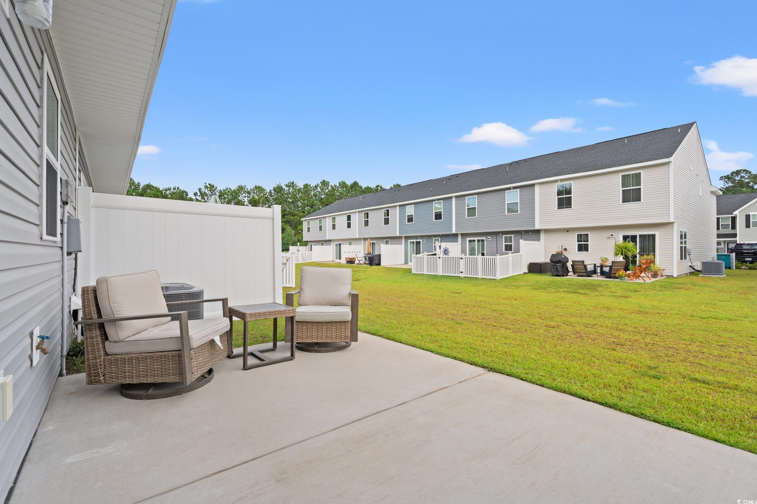 301 Granada Street, Unit D Myrtle Beach, SC 29579 - Photo 24 of 33 View of patio / terrace with a grill and a residential view
