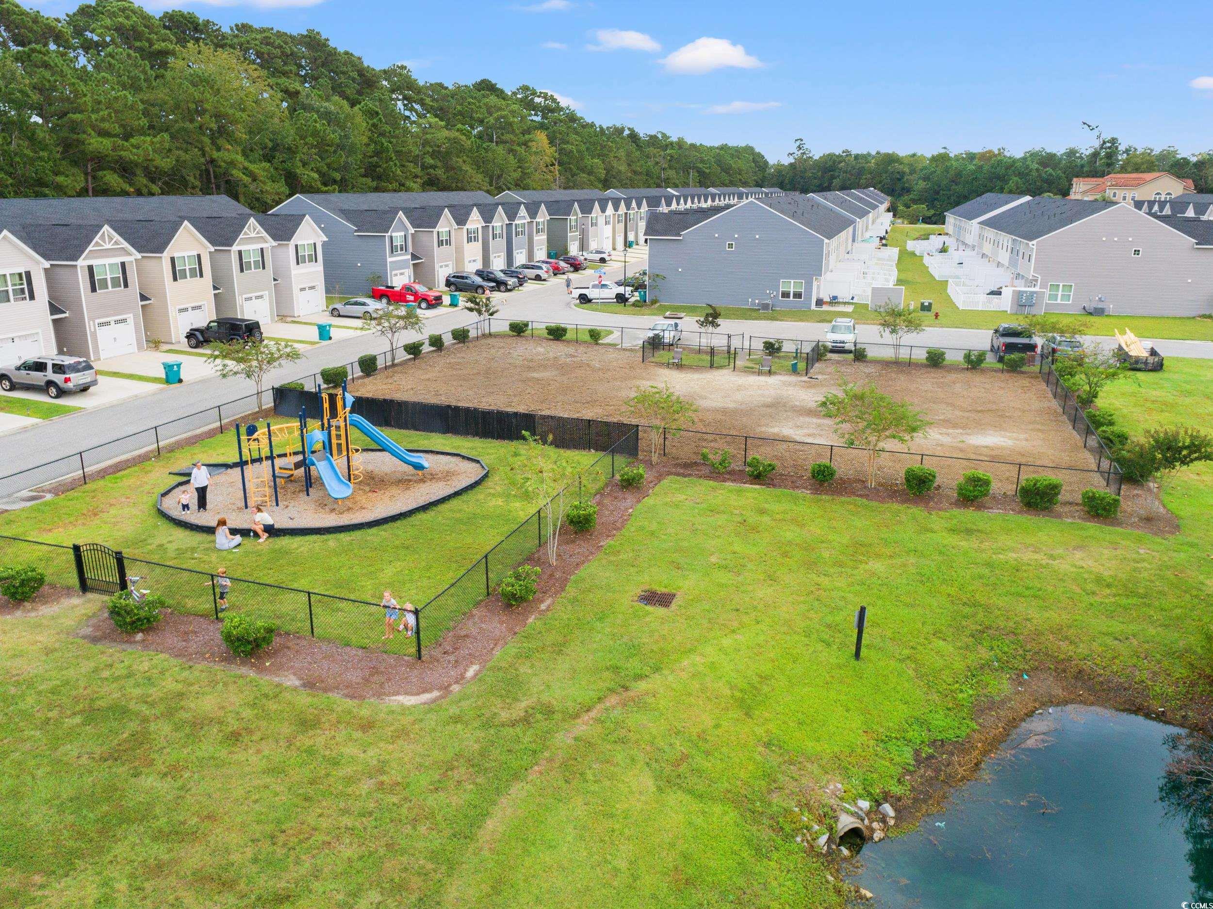 301 Granada Street, Unit D Myrtle Beach, SC 29579 - Photo 31 of 33 Aerial perspective of suburban area featuring a community park