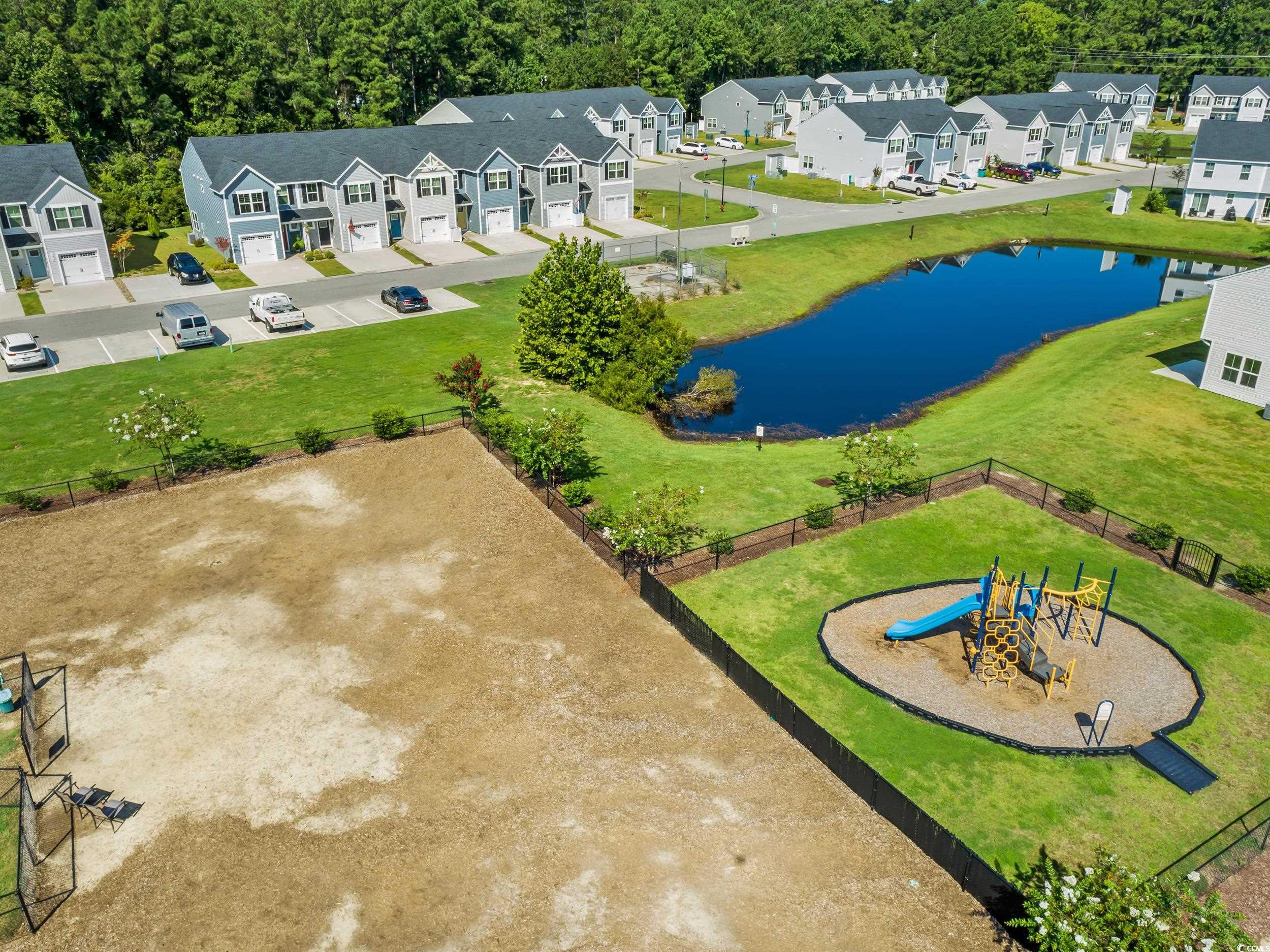 301 Granada Street, Unit D Myrtle Beach, SC 29579 - Photo 32 of 33 Aerial view of residential area with a nearby body of water and a community park