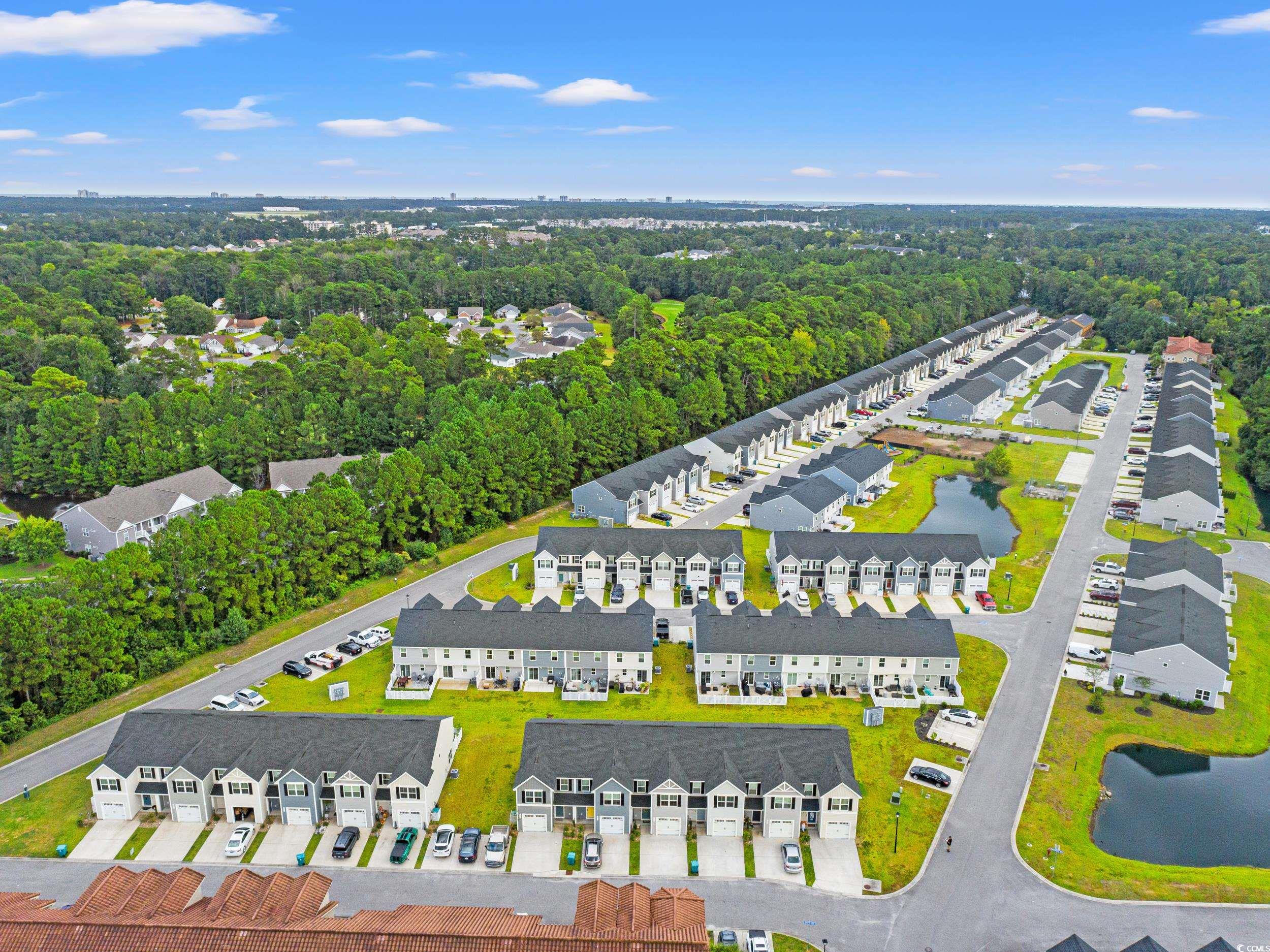 301 Granada Street, Unit D Myrtle Beach, SC 29579 - Photo 33 of 33 Aerial view of residential area featuring a heavily wooded area
